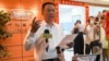 Hsu Ching-kuang (L), head of Taiwanese company Gold Apollo, speaks to the media outside the company's office in New Taipei City on September 18, 2024.