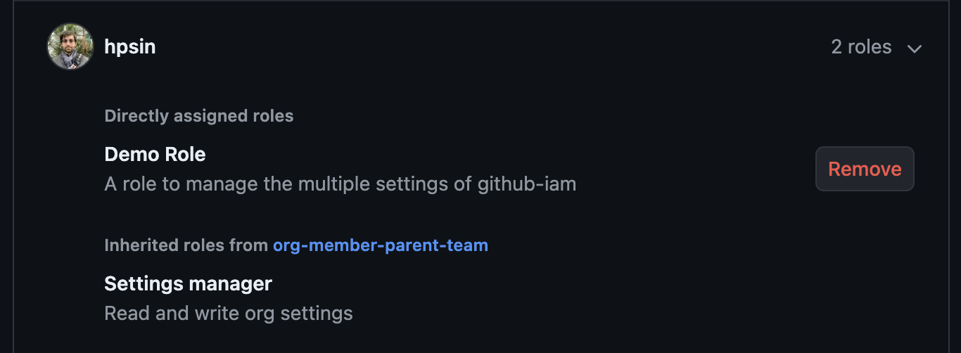 A screenshot showing a user that has been granted two roles. One is directly assigned, and has a remove button on the right hand side of the row. The other is indirectly assigned via a team named org-member-parent-team, and does not have a remove option.