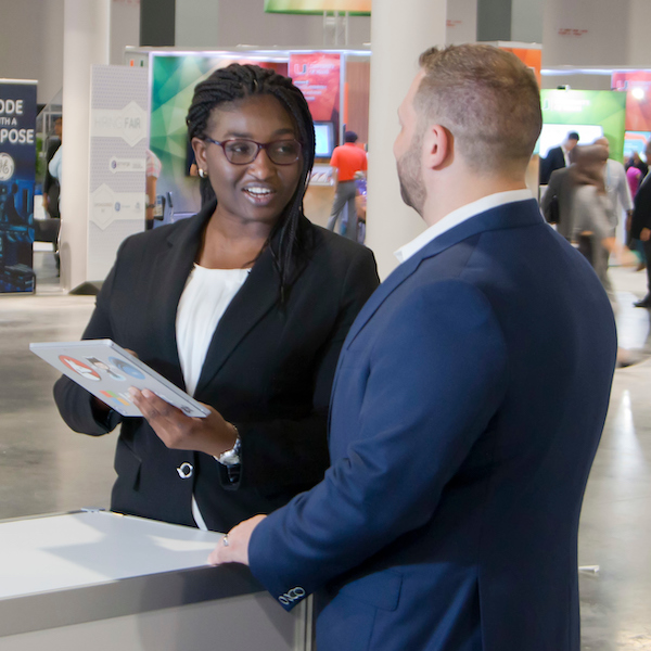 Two NSU Alumni at a career fair