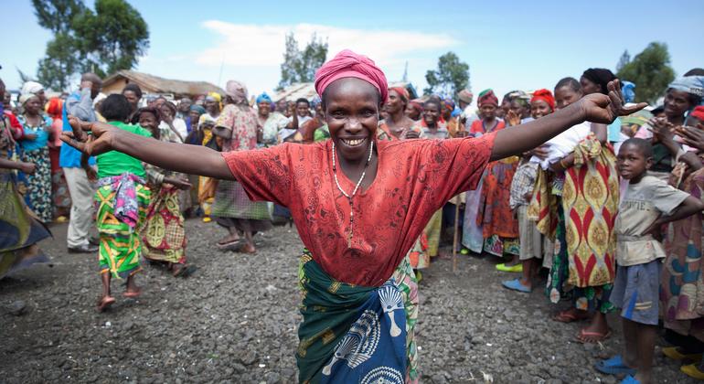 A woman greets members of the Technical Committee of the peace, security and cooperation framework for the Democratic Republic of the Congo and the region during a field visit to the Mugunga camp for internally displacement people near Goma.