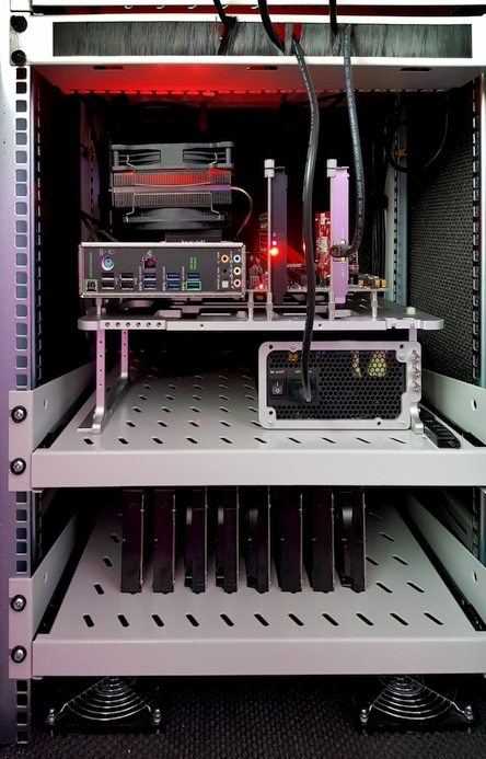 A photo of an open-bench mounted server in a server rack.