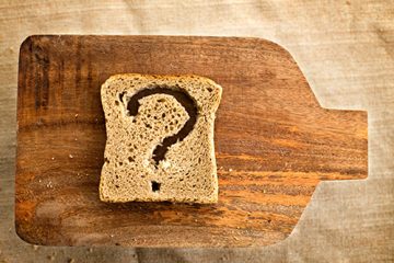 A piece of bread on a cutting board