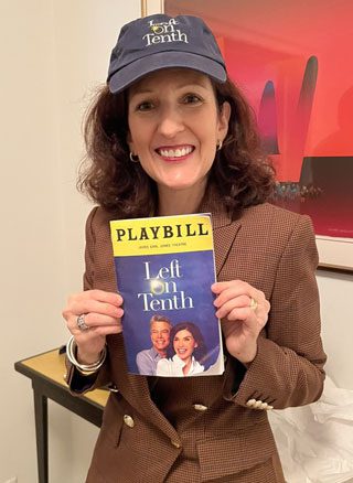 Dr. Gail Roboz wearing a "Left on Tenth" hat and holding a playbill