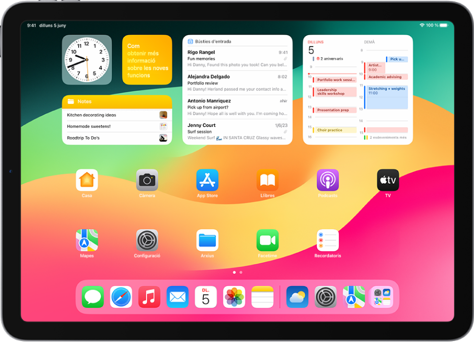 La pantalla d’inici amb el Dock, en què es mostren set apps favorites a l’esquerra i tres de suggerides a la dreta. La icona de l’extrem dret del Dock obre la biblioteca d’apps.