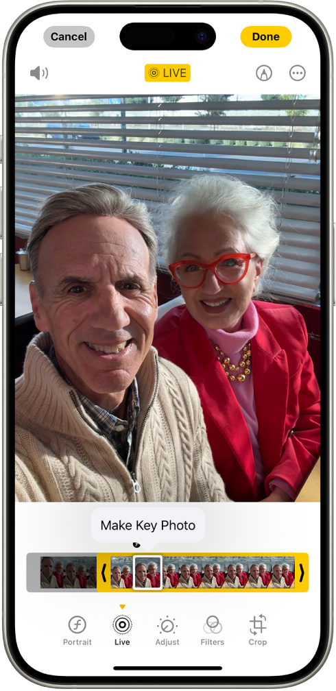 A Live Photo is open in the Photos app. Beneath the photo is the frame viewer with the Make Key Photo button active. On either end of the frame viewer are two arrows that allow you to trim the Live Photo. At the bottom of the screen are the Portrait, Live, Adjust, Filters, and Crop buttons. The Live button is selected.
