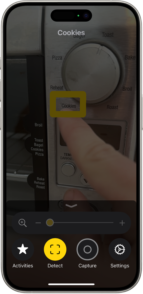 The Magnifier app detecting a finger pointing at text on a kitchen appliance.