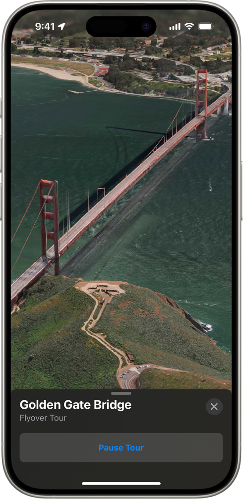 A Flyover tour in progress, showing a 3D image from the sky looking toward a landmark and a button to pause the tour.