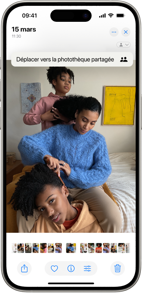 Une photo est ouverte dans l’app Photos. En haut de l’écran se trouve l’option « Déplacer vers la photothèque partagée ».