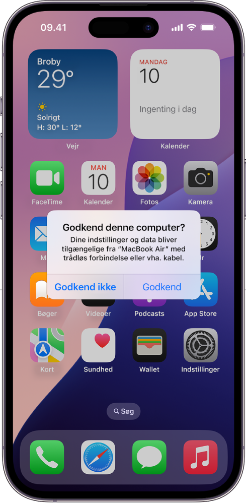 En iPad med dialogen Godkend denne computer? når der først oprettes forbindelse til en MacBook Air.