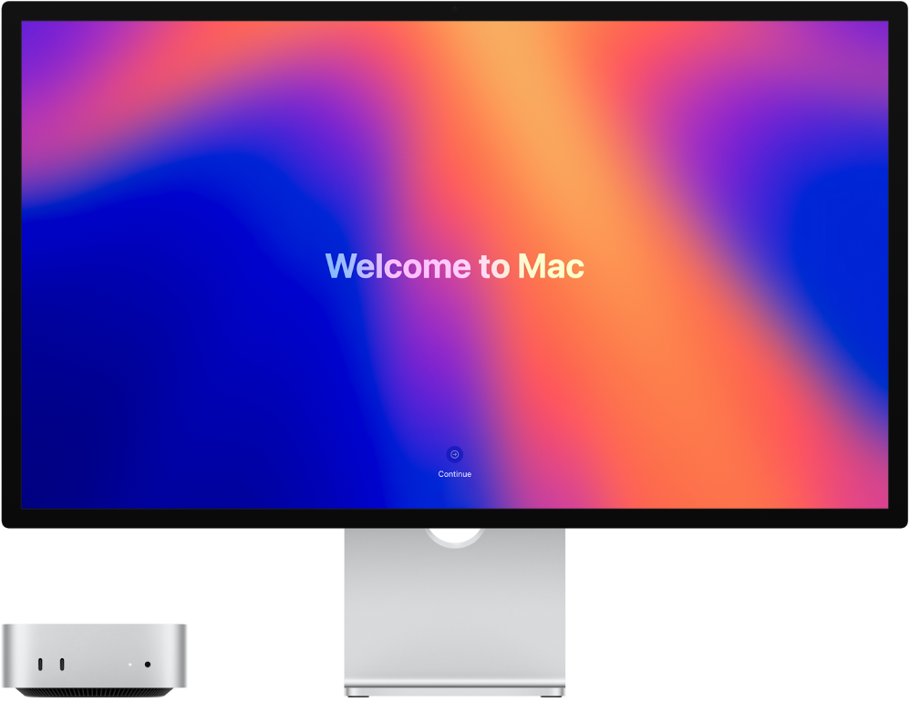 Mac mini in Studio Display drug ob drugem z besedo »zdravo« na zaslonu.