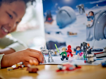 young girl plays with lego star wars advent calendar 2024