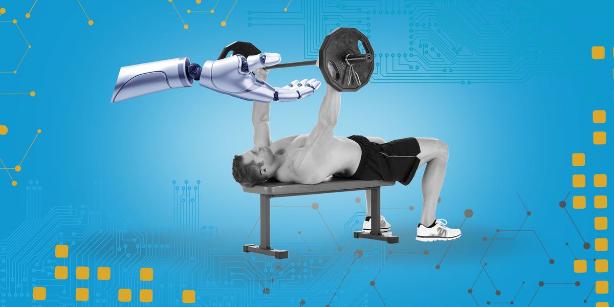 a man bench pressing weights assisted by a robotic arm