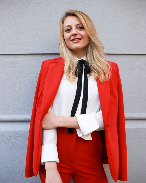 a woman in a red coat