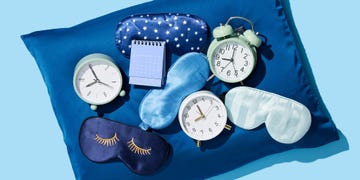 sleep masks and clocks on a pillow