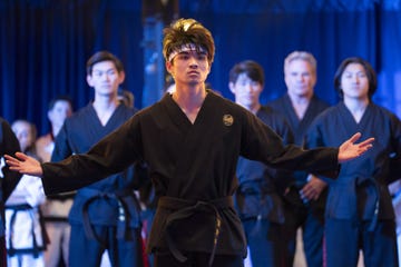 a martial arts demonstration featuring several participants in black uniforms