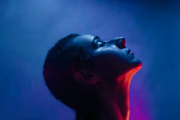 conceptual portrait of woman in neon light