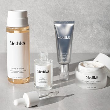 skincare products arranged on a textured surface