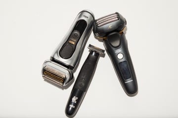 the image features three electric shavers laid flat on a white surface