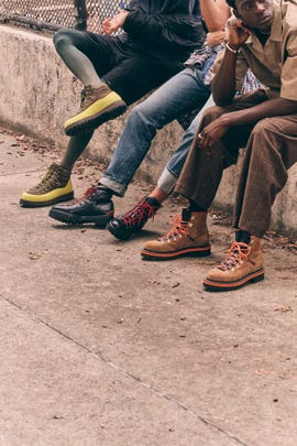 hiking boots displayed on a concrete surface