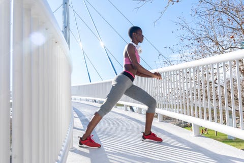 a person performing a lunge exercise on a bridge