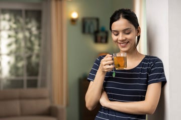 young woman drinking green tea