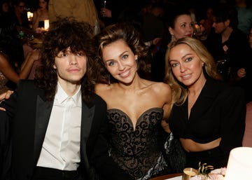 los angeles february 4 maxx morando, miley cyrus, and brandi cyrus behind the scenes at the 66th annual grammy awards, airing live from cryptocom arena in los angeles, california, sunday, feb 4 800 1130 pm, live et500 830 pm, live pt on the cbs television network photo by francis speckercbs via getty images