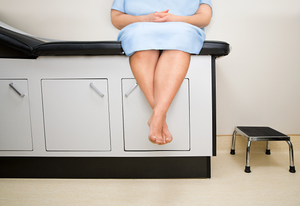 patient sitting on treatment couch