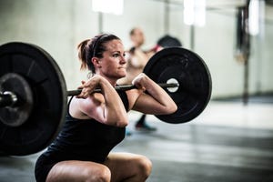 gym   woman doing front squats