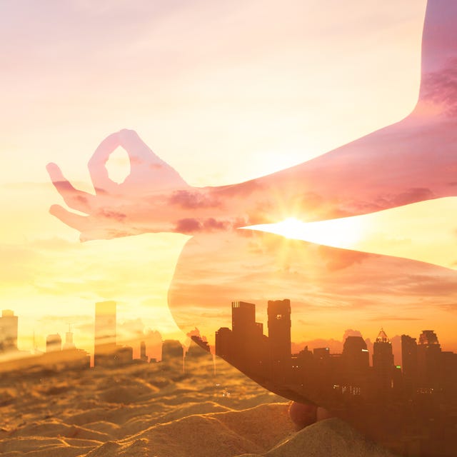 person meditating over a busy city background