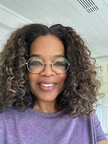 oprah wearing a purple shirt indoors