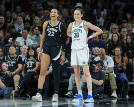 aja wilson and breanna stewart stand next to each other