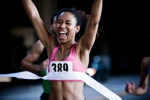 runner crossing the finish line