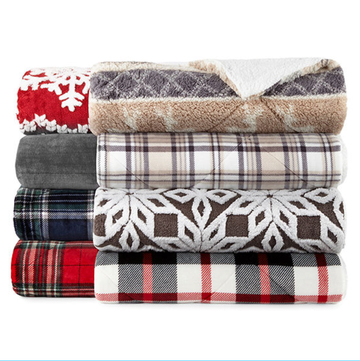 stack of various patterned blankets