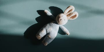 stuffed rabbit for a child on dark background