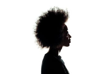 silhouette of african american woman with afro hairstyle isolated on white