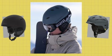 collection of ski helmets with a person wearing one