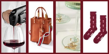 a wine pourer dispensing red wine into a glass, a stylish brown tote bag with wine bottles inside, elegant coasters with decorative charms, and burgundy socks featuring wine glass patterns