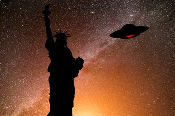 the statue of liberty and ufo in the starry sky new york