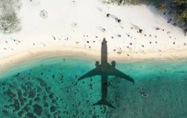 plane shadow over beach