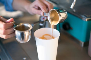 cu woman making a coffee drink