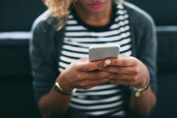 Woman's hands holding smartphone