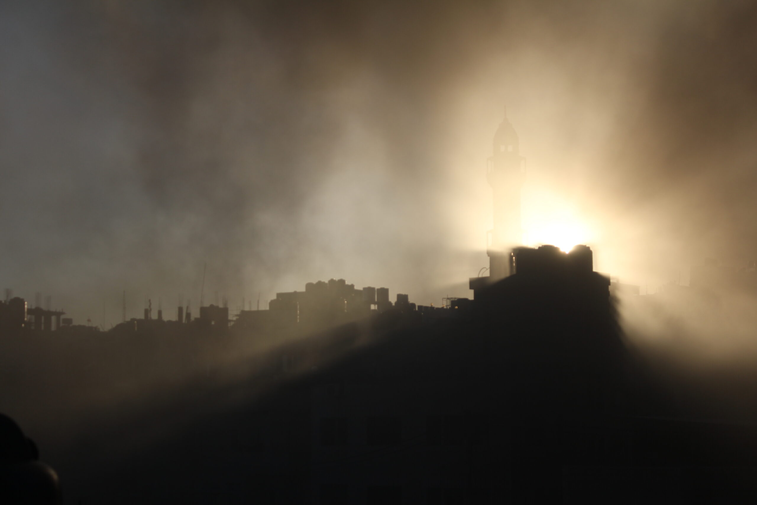 Gas or dust engulfs a mosque.