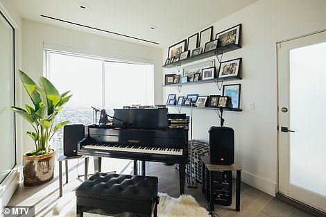 There is a cozy nook just outside the bedroom where Nicole keeps her grand piano