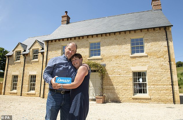 Omaze pushed back on claims about the property being prone to flooding, saying there was 'exceptionally heavy' rain on December 23. Pictured: Mr Warden and his wife