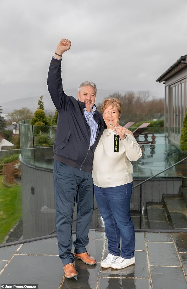 The couple confessed their children had greeted them after their holiday by spraying champagne over them (pictured, with the keys to their new home)