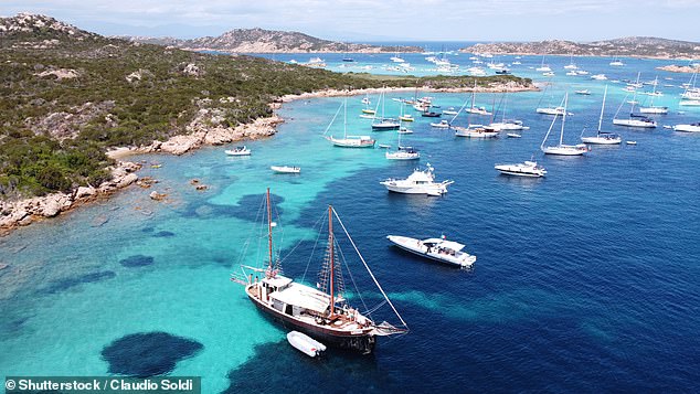 A boat trip is the only way to appreciate the beauty of the Sardinian seas, says Rob. Pictured: Boats anchored near the shores of Budelli island