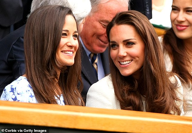 The sisters smiling and chatting with each other in the Royal Box during the Wimbledon final in 2012