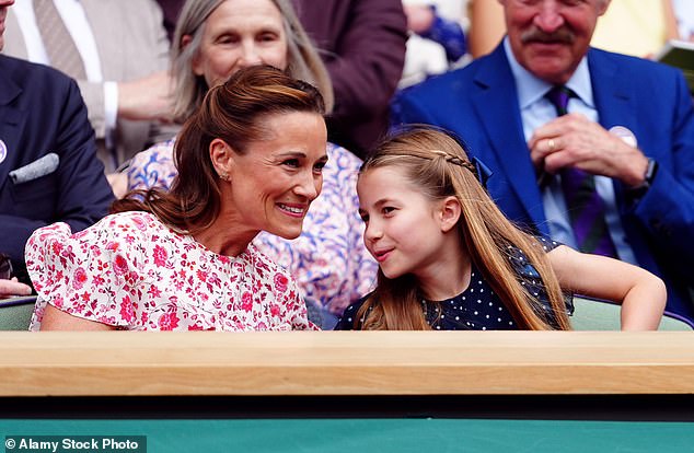 Pippa leans in to listen to her niece, Princess Charlotte, while they watch tennis in July