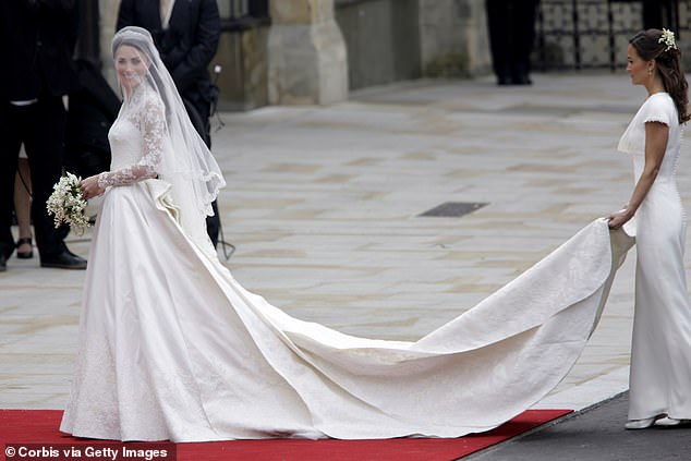 Pippa holding Kate's train as her sister arrives for her wedding to Prince William at Westminster Abbey in April 2011