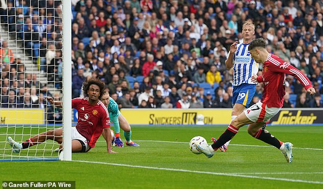 His shot deflected off fellow substitute Joshua Zirkzee (left) who was in an offside position